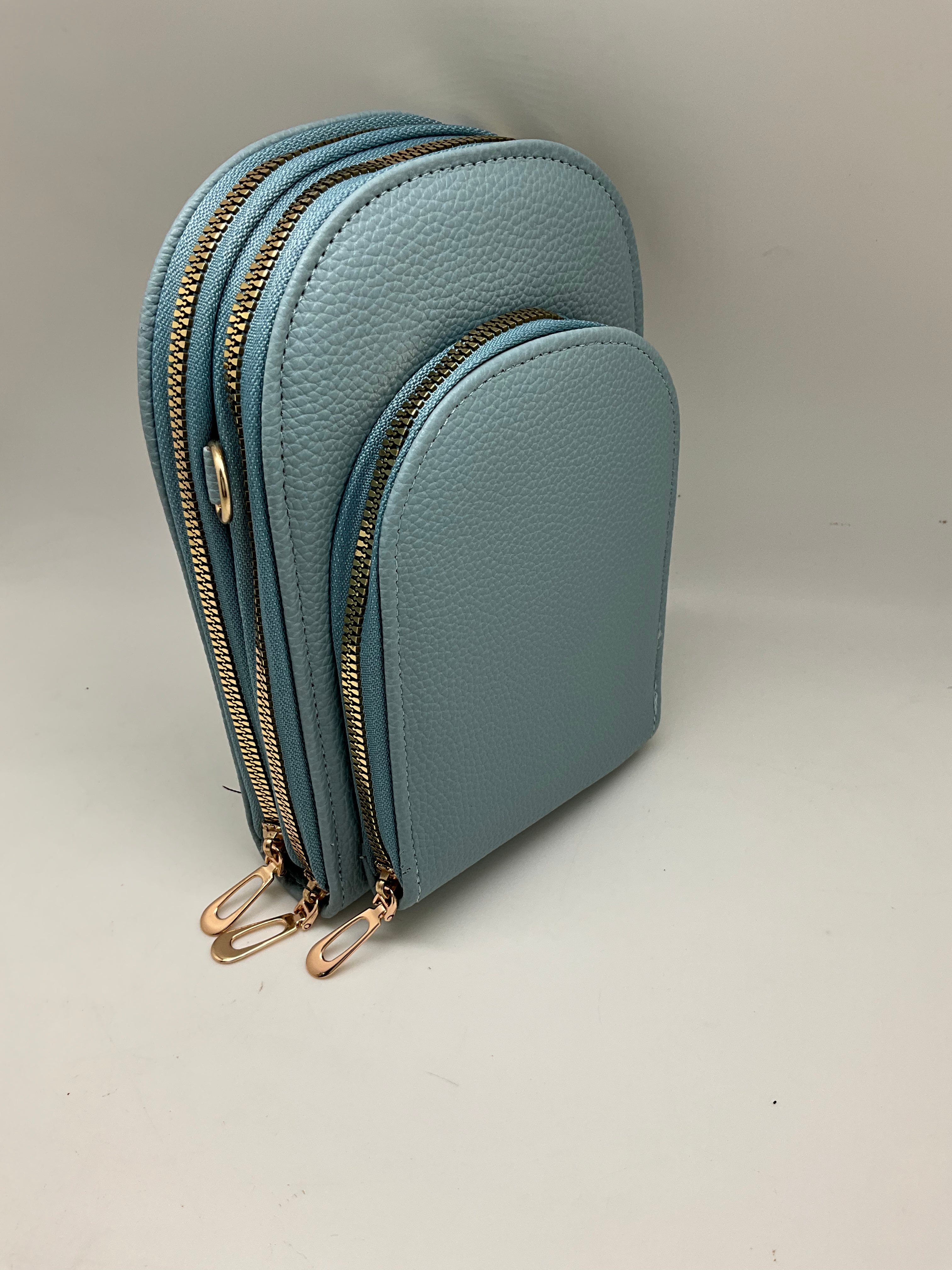 CROSSBODY OVAL 3 ZIPPERED  POCKET BAG